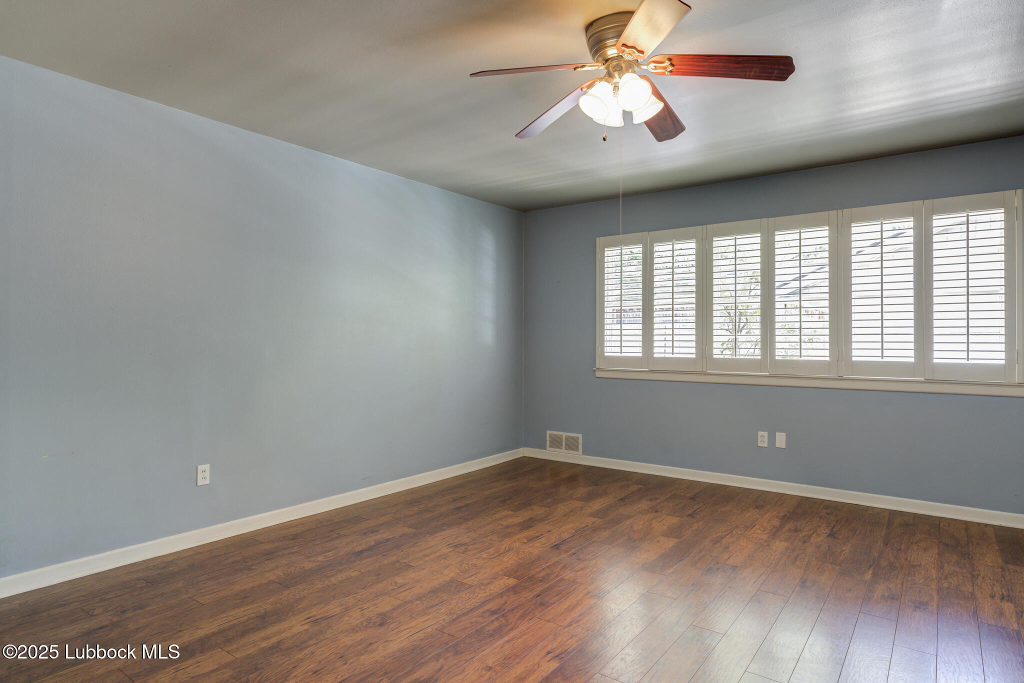 4608 18th Street Lubbock, TX 79416 - Photo 67 of 84 wooden floor in an empty room with a window