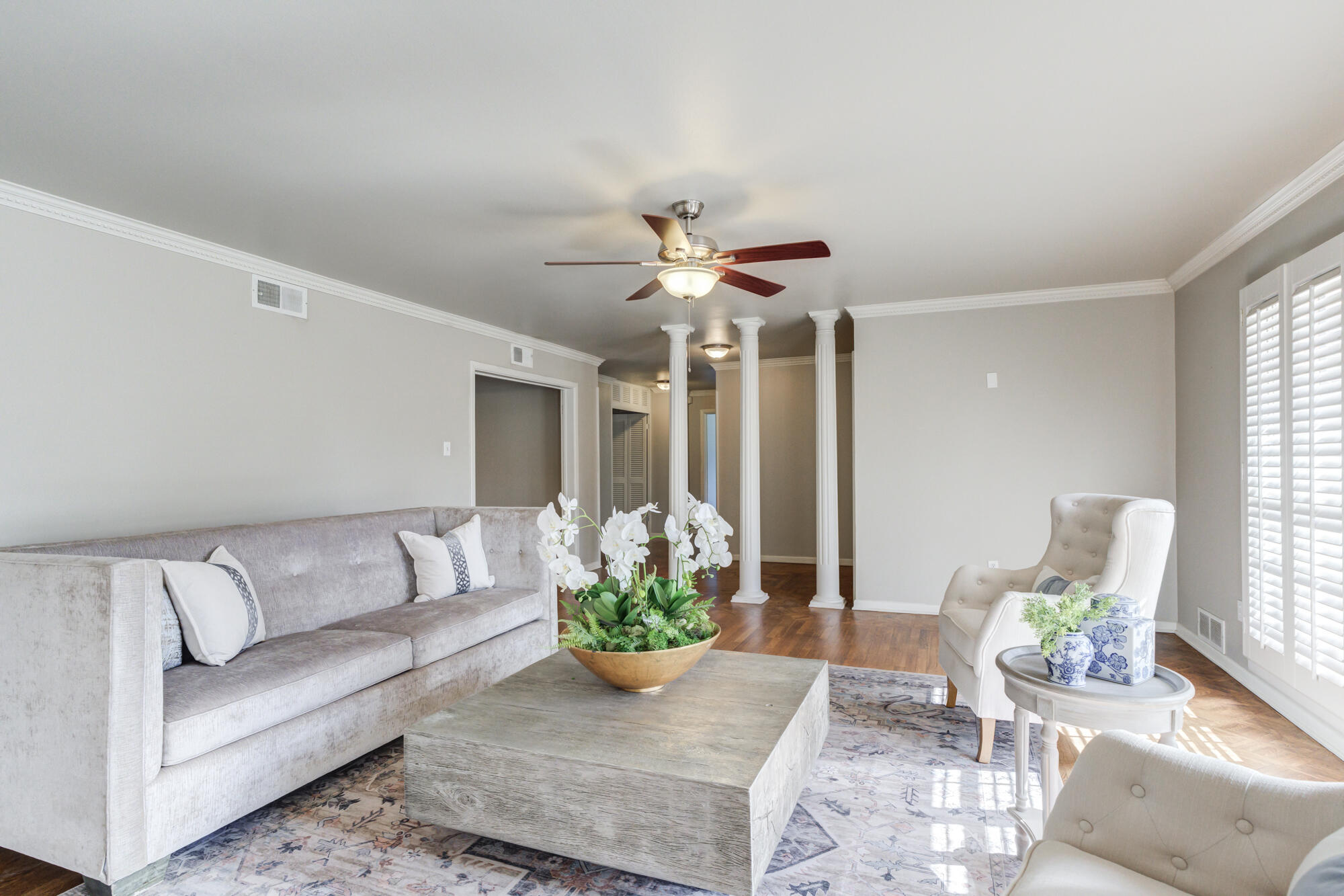 4608 18th Street Lubbock, TX 79416 - Photo 10 of 84 a living room with furniture and a chandelier