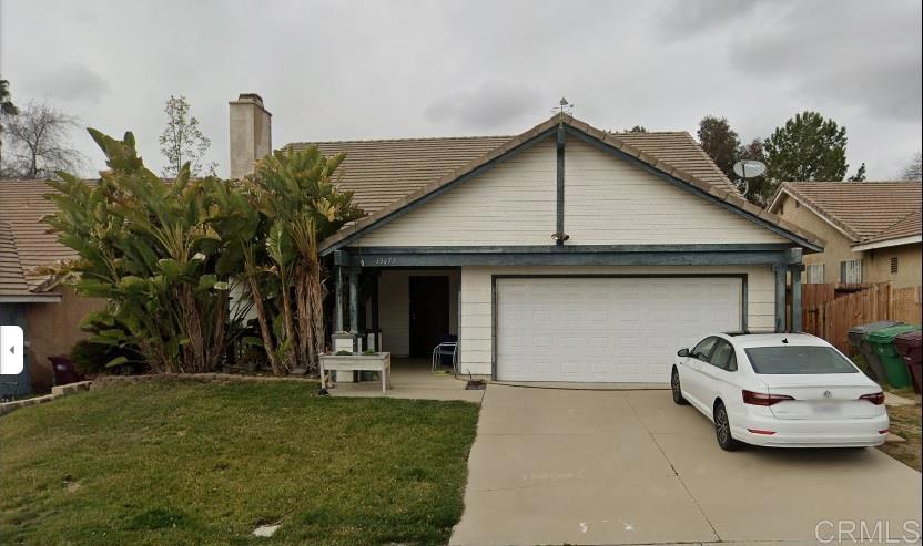 33655 Canyon Ranch Road Wildomar, CA 92595 - Photo 1 of 1 a car parked in front of white house