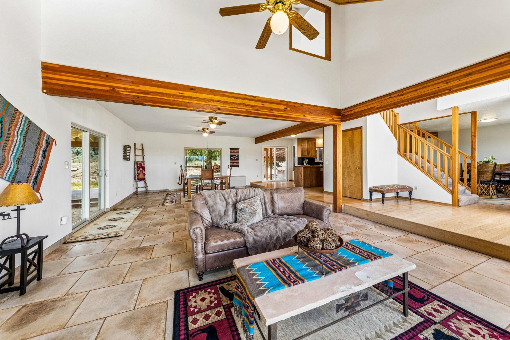 22480 Rd L Cortez, CO 81321 - Photo 5 of 44 a living room with furniture and a floor to ceiling window