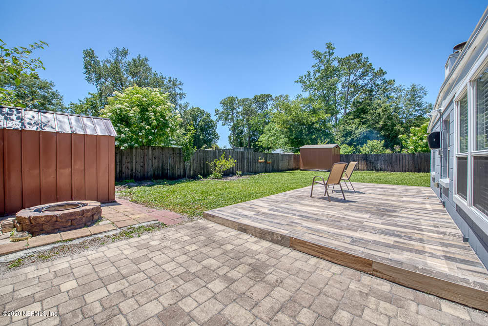 5128 Spring Glen Road Jacksonville, FL 32207 - Photo 11 of 24 a view of a backyard with sitting area