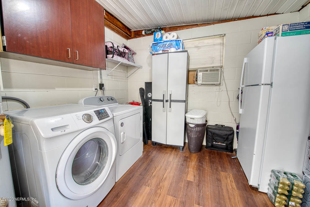 5128 Spring Glen Road Jacksonville, FL 32207 - Photo 21 of 24 a utility room with dryer and washer