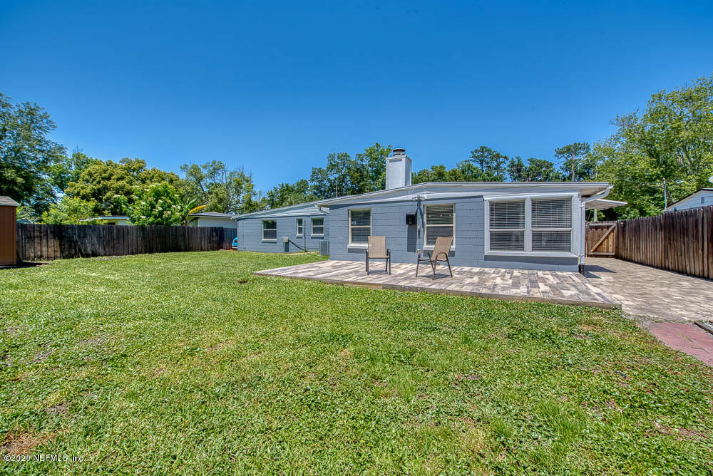 5128 Spring Glen Road Jacksonville, FL 32207 - Photo 24 of 24 a front view of house with yard and green space
