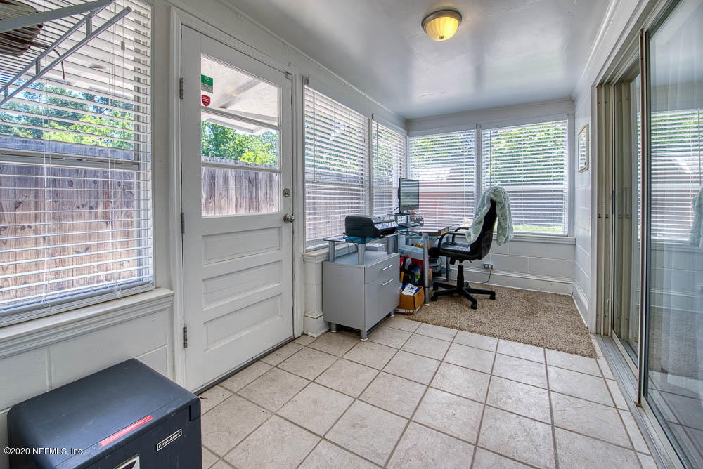 5128 Spring Glen Road Jacksonville, FL 32207 - Photo 10 of 24 a view of a workspace with furniture and a window