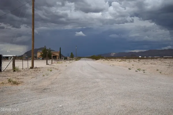 a view of a road with an ocean view