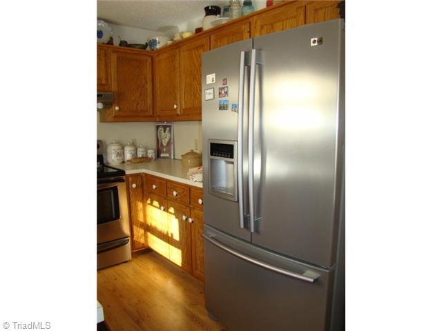 3322 Gallimore Dairy Road Denton, NC 27239 - Photo 6 of 16 Kitchen. All appliances remain including stainless refrigerator!