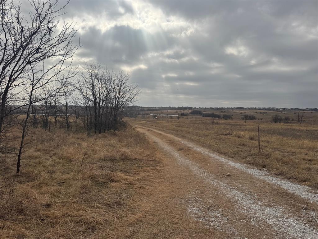 1121 County Road 4522 Decatur, TX 76234 - Photo 5 of 14 a view of a dry yard with wooden fence