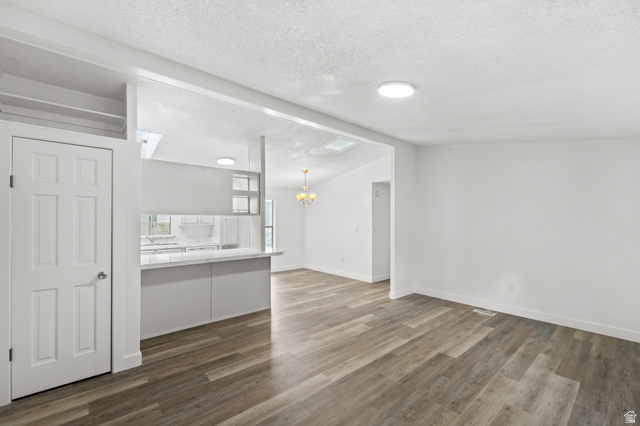 2875 North 400 West, Unit 7 Layton, UT 84041 - Photo 8 of 29 Open-concept interior featuring wood-finish flooring, white walls, and recessed lighting