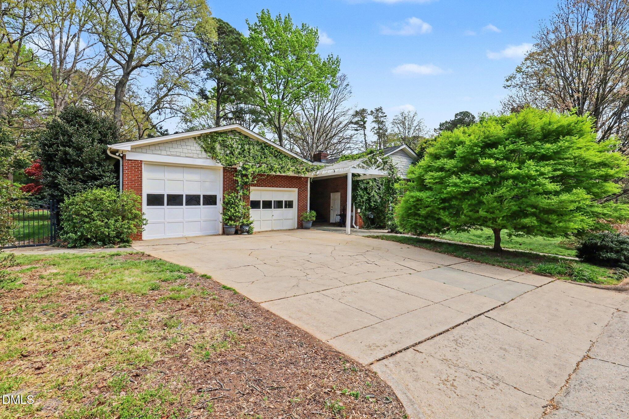 1212 Kershaw Drive Raleigh, NC 27609 - Photo 7 of 42 Oversized Garage for bigger cars & trucks.