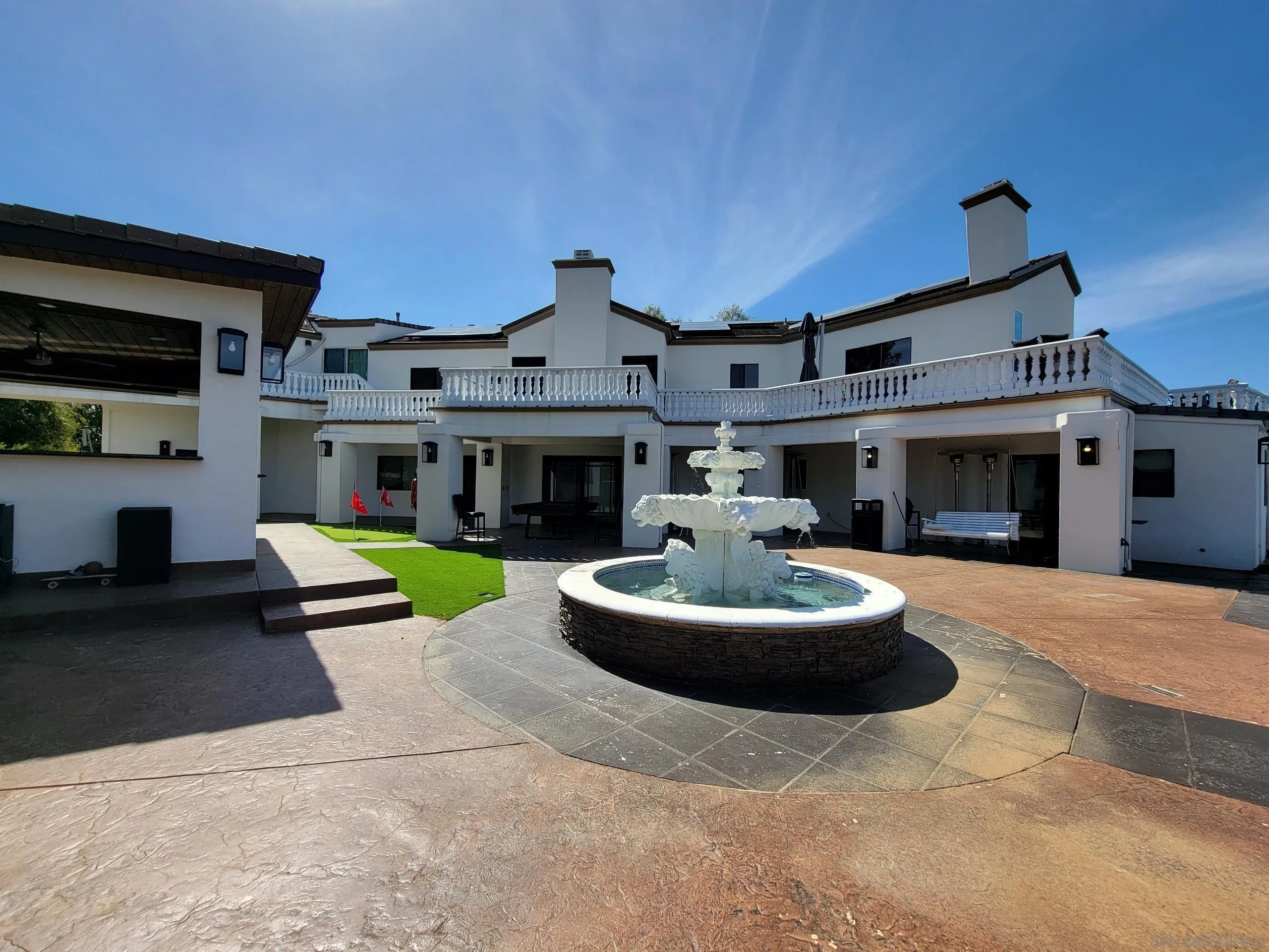 2715 Via Chinarros Alpine, CA 91901 - Photo 2 of 8 a front view of a house with a yard fire pit and outdoor seating