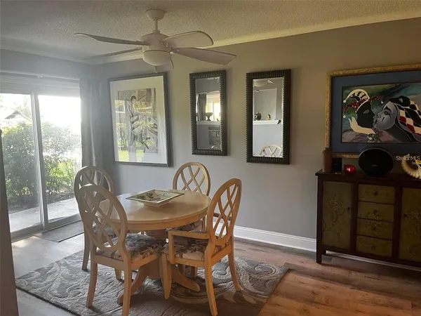a dining room with furniture and window