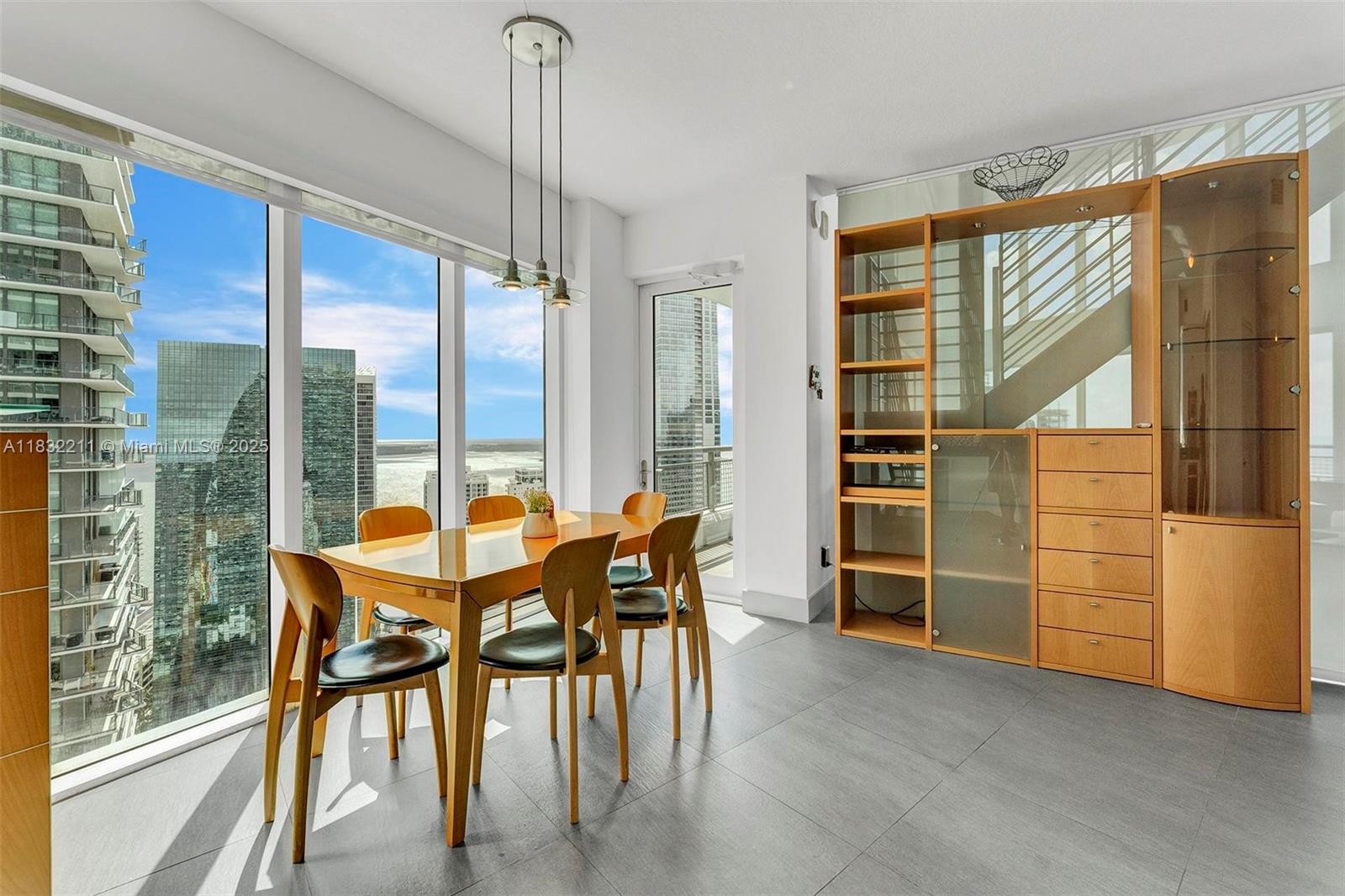 60 Southwest 13th Street, Unit 3400 Miami, FL 33130 - Photo 13 of 51 a view of a dining room with furniture window and outside view