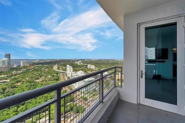 a view of a patio with table and chairs