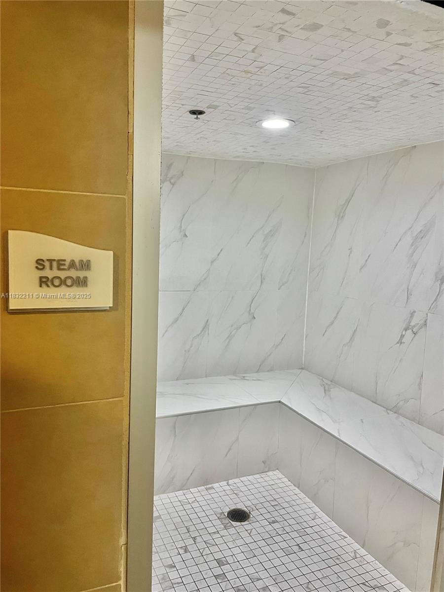 60 Southwest 13th Street, Unit 3400 Miami, FL 33130 - Photo 37 of 51 a bathroom with a shower