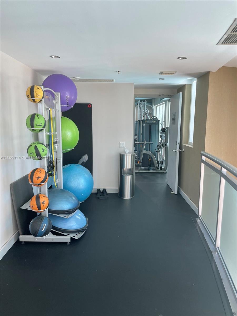 60 Southwest 13th Street, Unit 3400 Miami, FL 33130 - Photo 38 of 51 a room with furniture and gym equipment