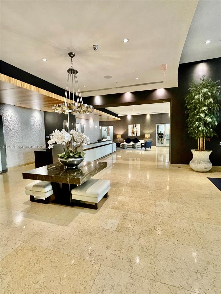 60 Southwest 13th Street, Unit 3400 Miami, FL 33130 - Photo 41 of 51 a room with lots of potted plants