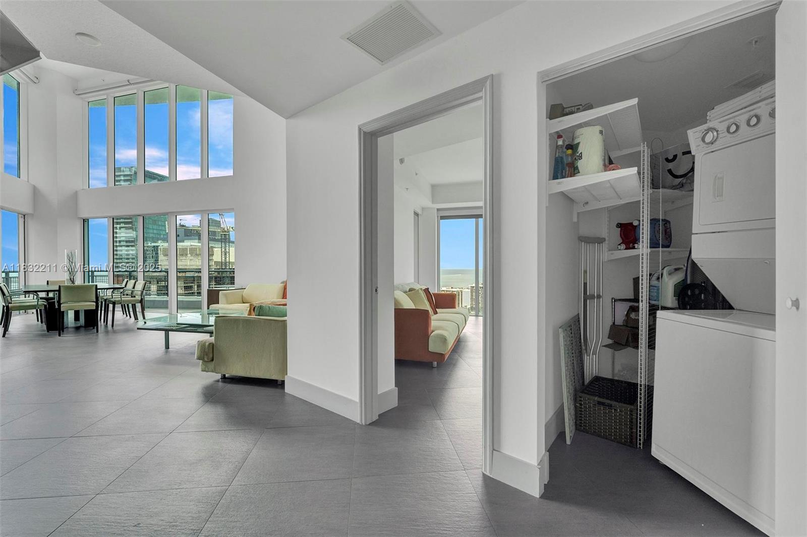 60 Southwest 13th Street, Unit 3400 Miami, FL 33130 - Photo 9 of 51 a living room with furniture and a large window