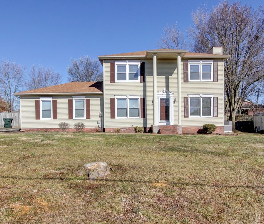 1105 Bark Ridge Circle Hopkinsville, KY 42240 - Photo 1 of 29 a front view of a house with a yard
