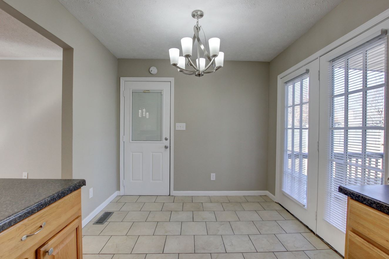 1105 Bark Ridge Circle Hopkinsville, KY 42240 - Photo 11 of 29 a view of an empty room with chandelier and a window