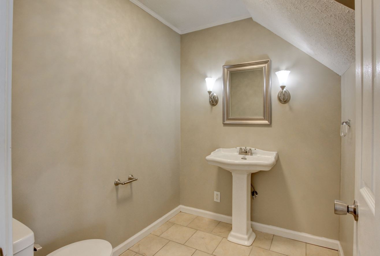 1105 Bark Ridge Circle Hopkinsville, KY 42240 - Photo 19 of 29 a bathroom with a sink mirror and toilet