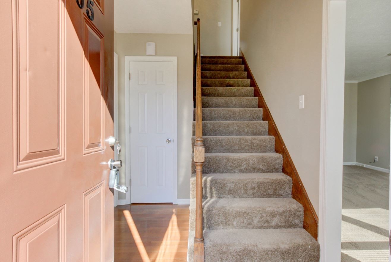 1105 Bark Ridge Circle Hopkinsville, KY 42240 - Photo 4 of 29 a view of staircase with white walls and windows