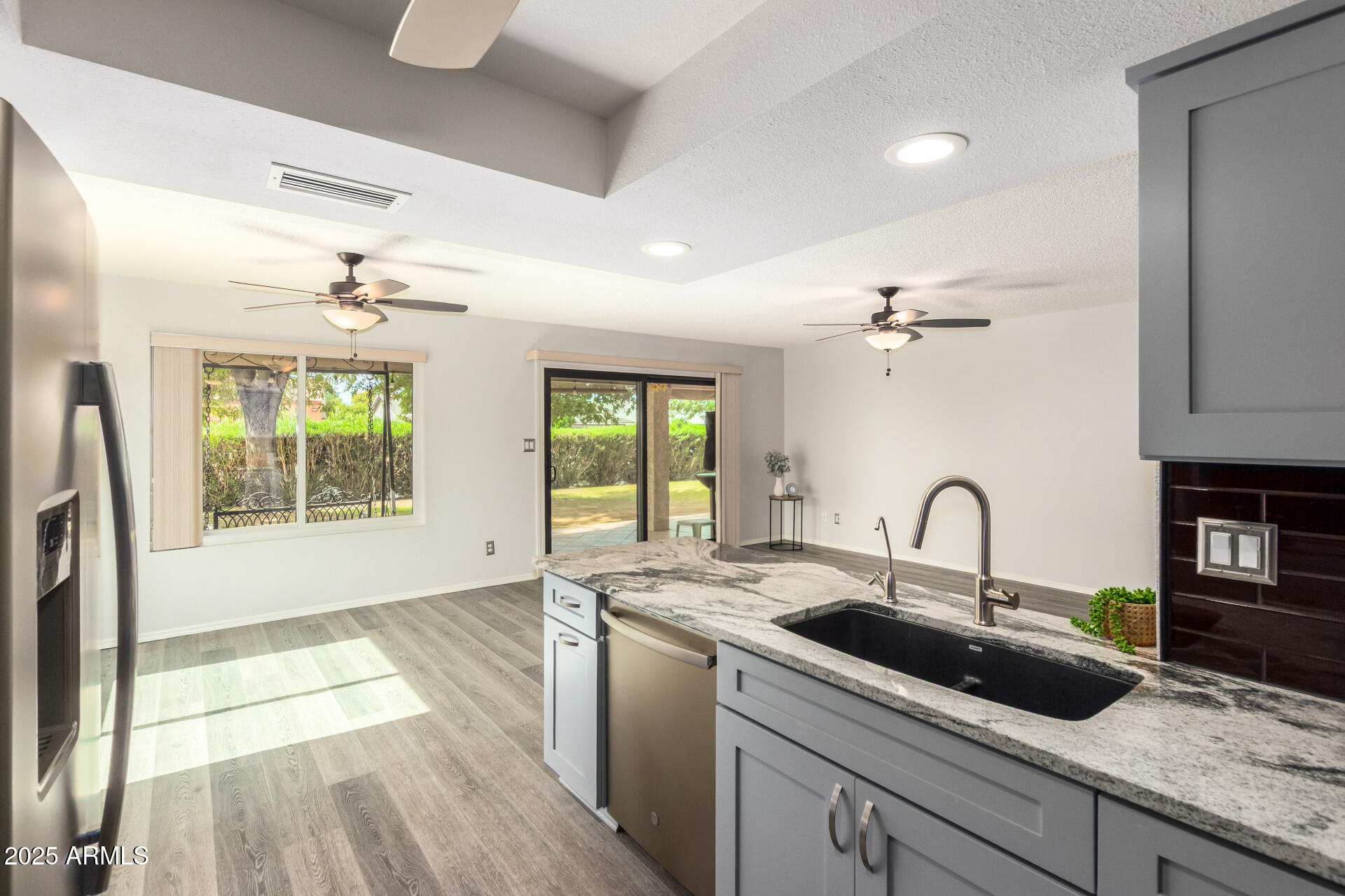 716 South Privet Way Mesa, AZ 85208 - Photo 12 of 40 a kitchen with a sink a counter appliances and a window