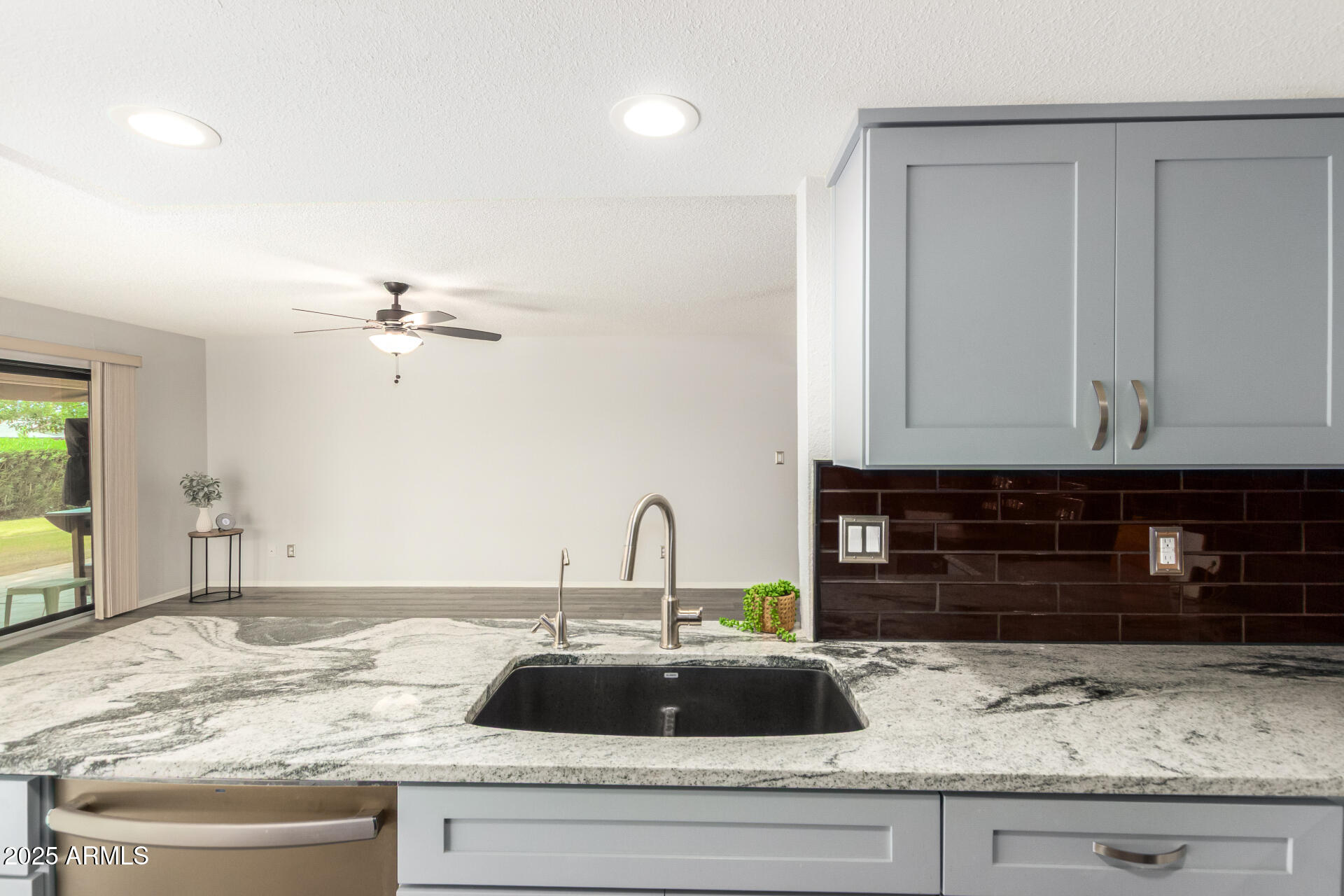 716 South Privet Way Mesa, AZ 85208 - Photo 15 of 40 a kitchen with a sink and cabinets