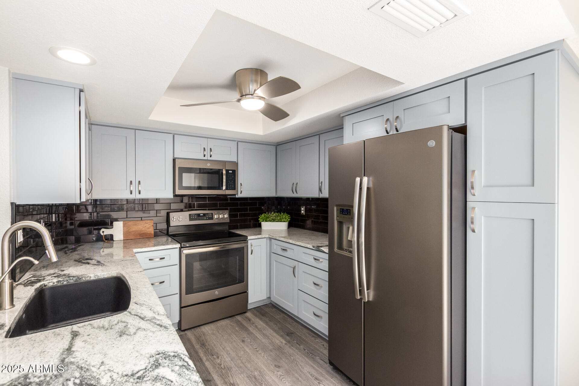 716 South Privet Way Mesa, AZ 85208 - Photo 16 of 40 a kitchen with stainless steel appliances a refrigerator sink and microwave