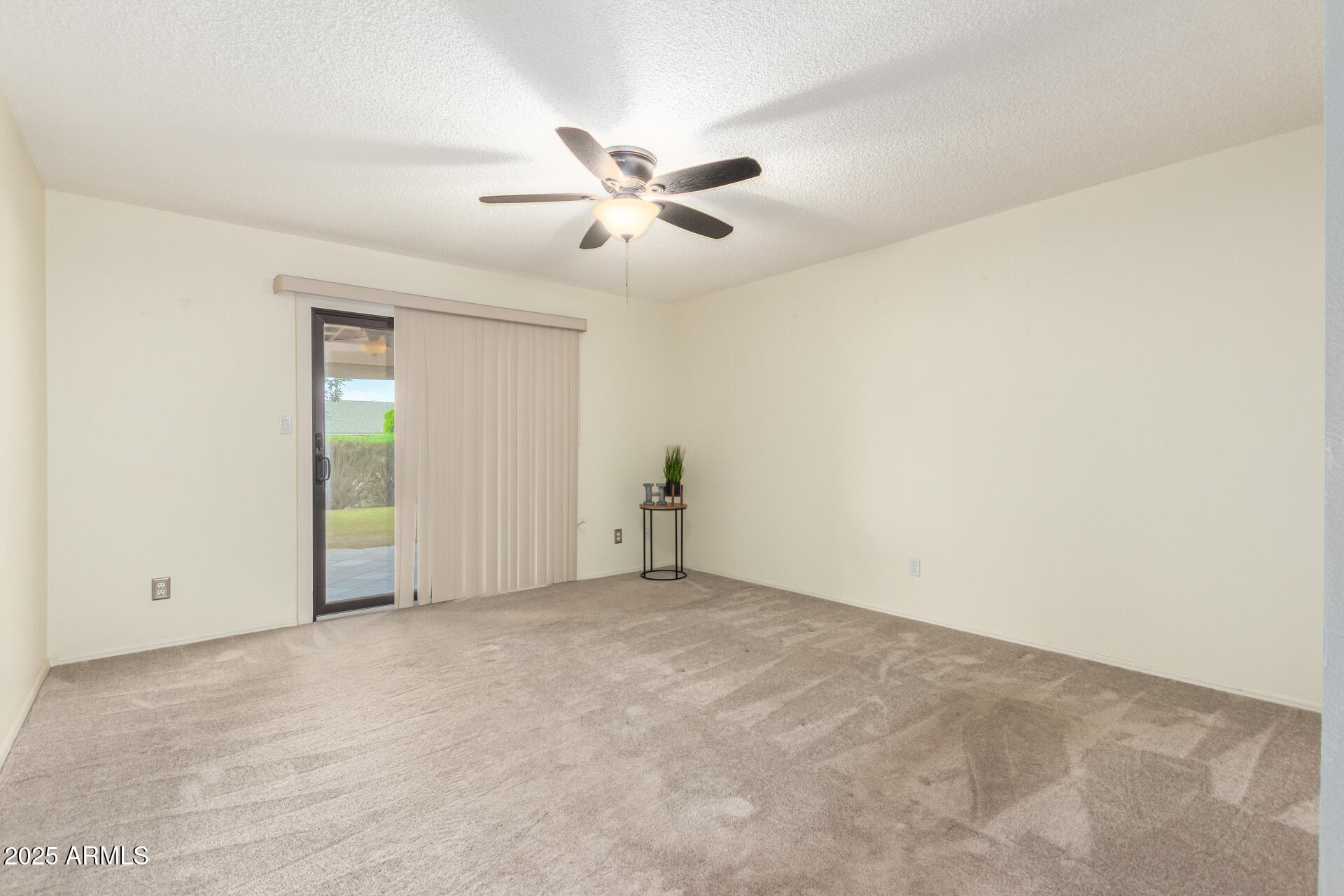 716 South Privet Way Mesa, AZ 85208 - Photo 22 of 40 an empty room with windows and fan