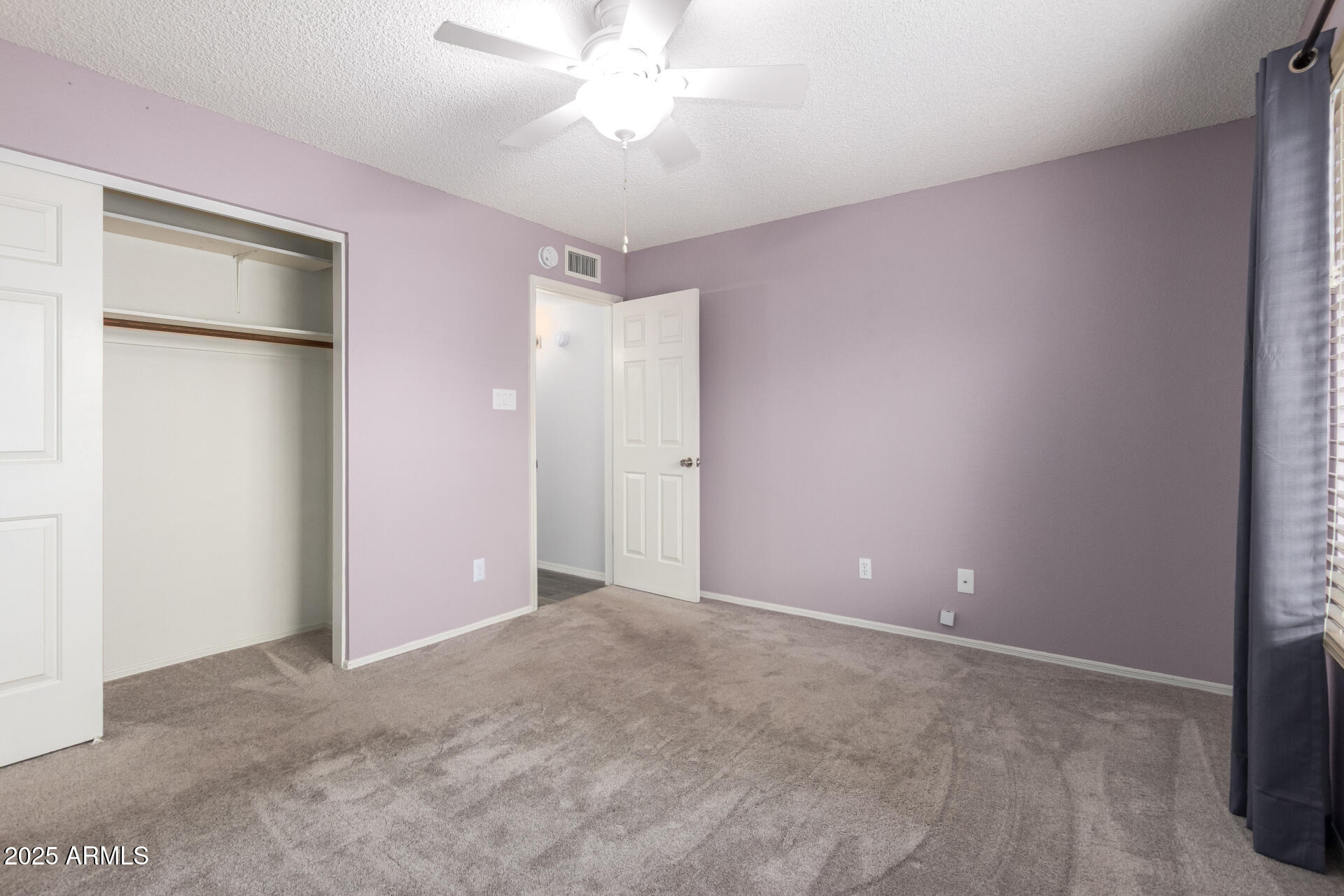 716 South Privet Way Mesa, AZ 85208 - Photo 28 of 40 a view of an empty room with a chandelier fan