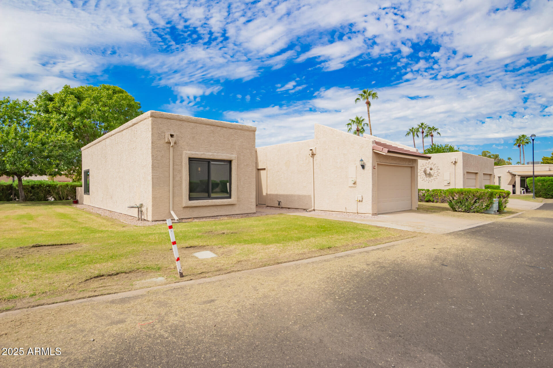 716 South Privet Way Mesa, AZ 85208 - Photo 3 of 40 a view of an house with backyard and tree