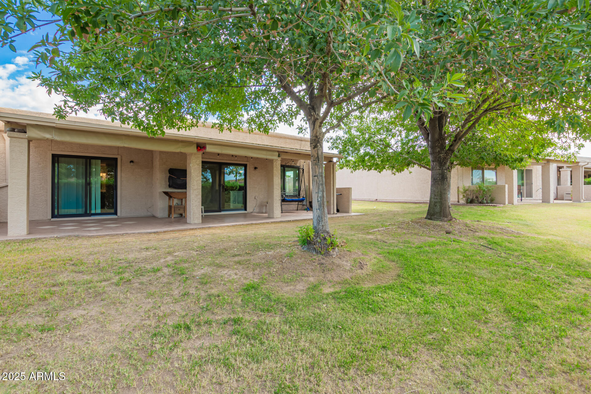 716 South Privet Way Mesa, AZ 85208 - Photo 35 of 40 a view of a yard in front of a house with large tree