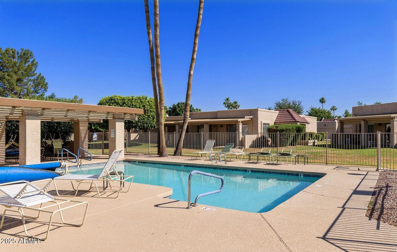 716 South Privet Way Mesa, AZ 85208 - Photo 37 of 40 a view of a house with swimming pool and sitting area