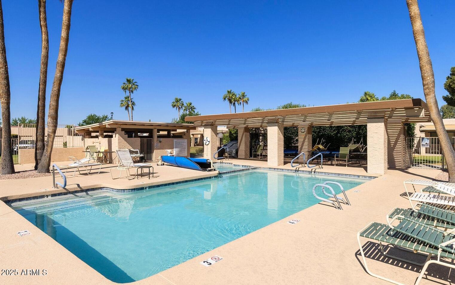 716 South Privet Way Mesa, AZ 85208 - Photo 38 of 40 a view of a house with swimming pool and sitting area