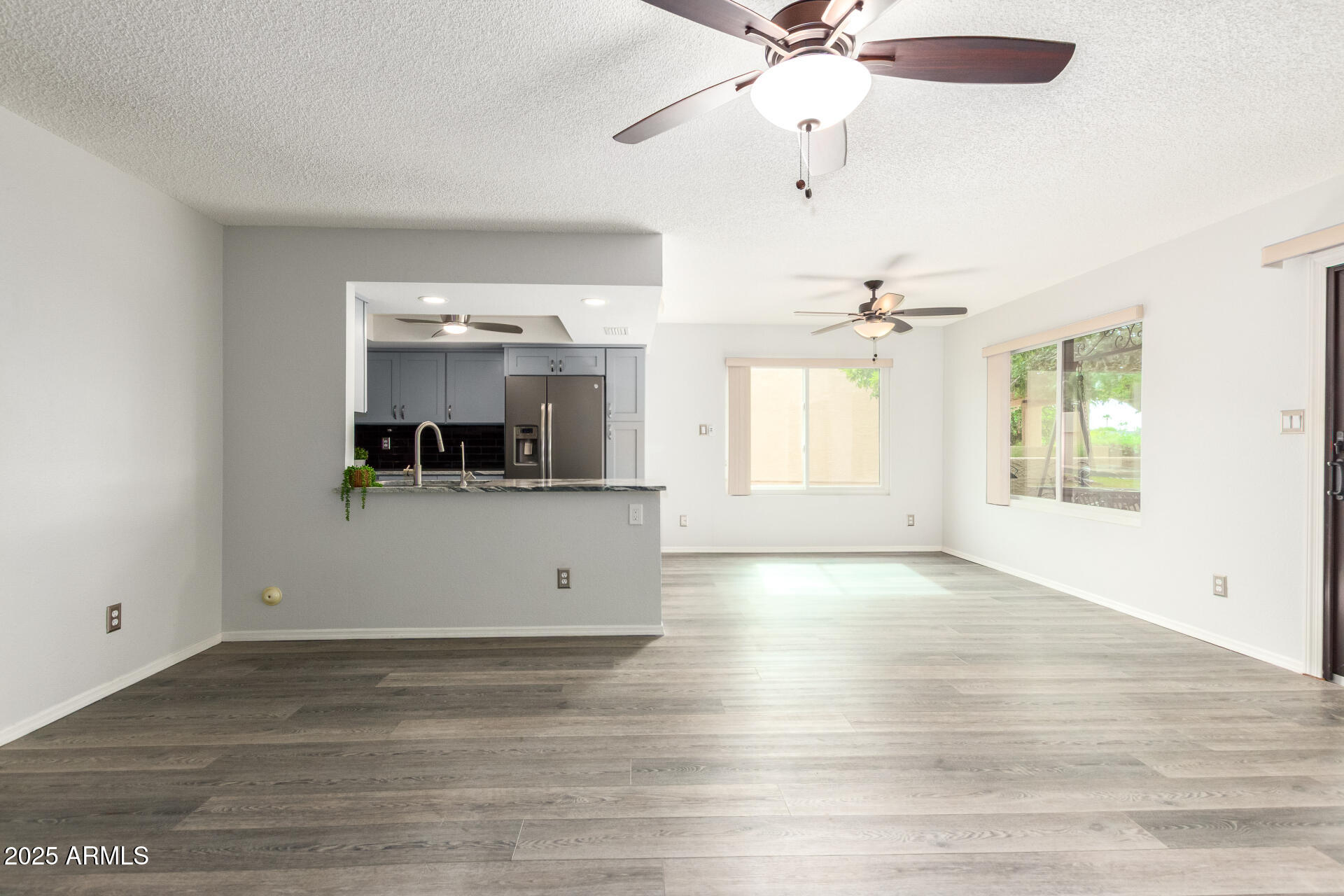 716 South Privet Way Mesa, AZ 85208 - Photo 10 of 40 wooden floor in an empty room with a window