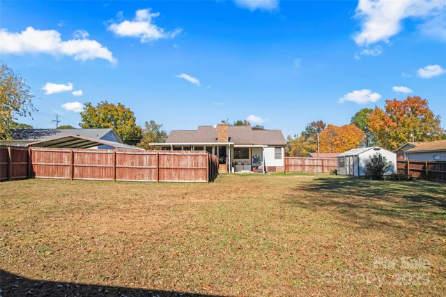 a view of a pool with a yard