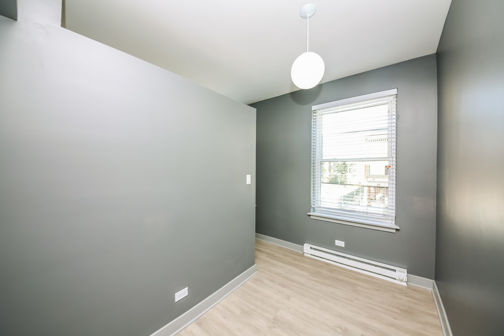 944 West Montrose Avenue, Unit 309 Chicago, IL 60613 - Photo 8 of 9 a view of an empty room with a window