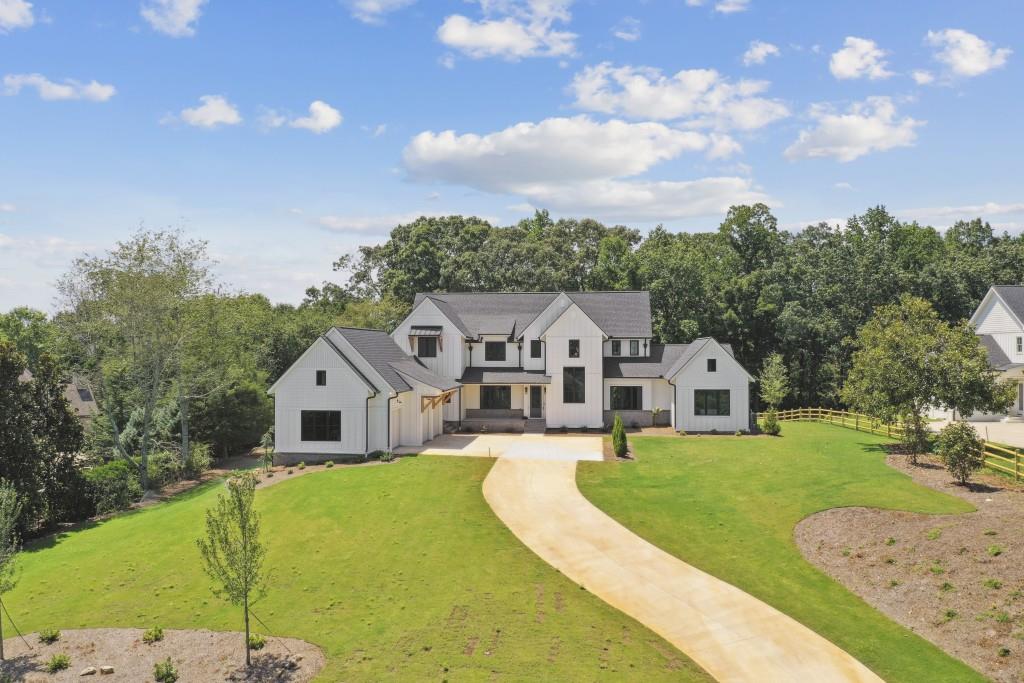 16025 Hopewell Road Milton, GA 30004 - Photo 1 of 1 a view of house with garden