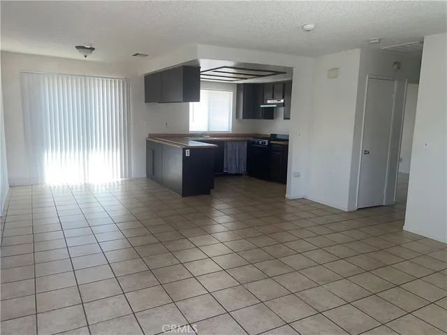 a kitchen with stainless steel appliances a sink and a counter top space