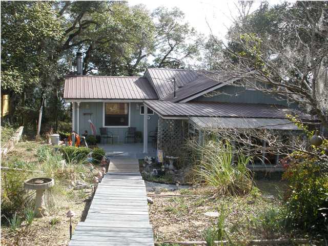 240 Wesley Road DeFuniak Springs, FL 32433 - Photo 1 of 25 a front view of a house with garden