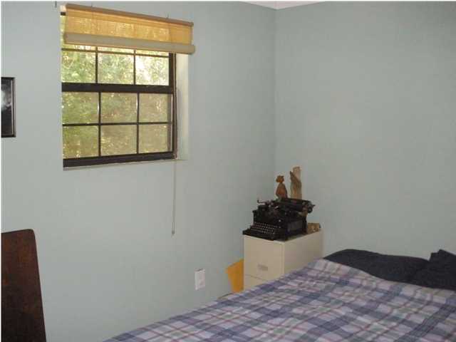 240 Wesley Road DeFuniak Springs, FL 32433 - Photo 13 of 25 a bedroom with a bed and a window