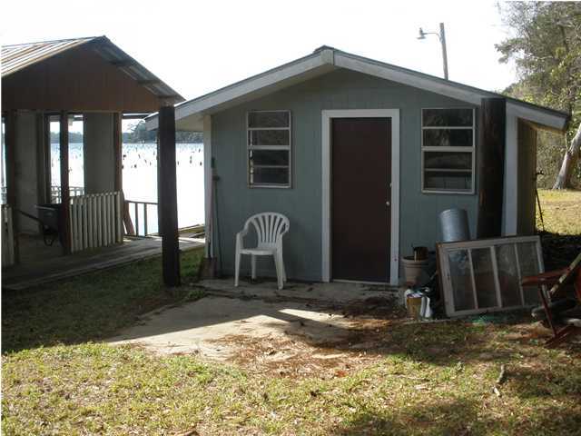 240 Wesley Road DeFuniak Springs, FL 32433 - Photo 20 of 25 a view of a house with a yard