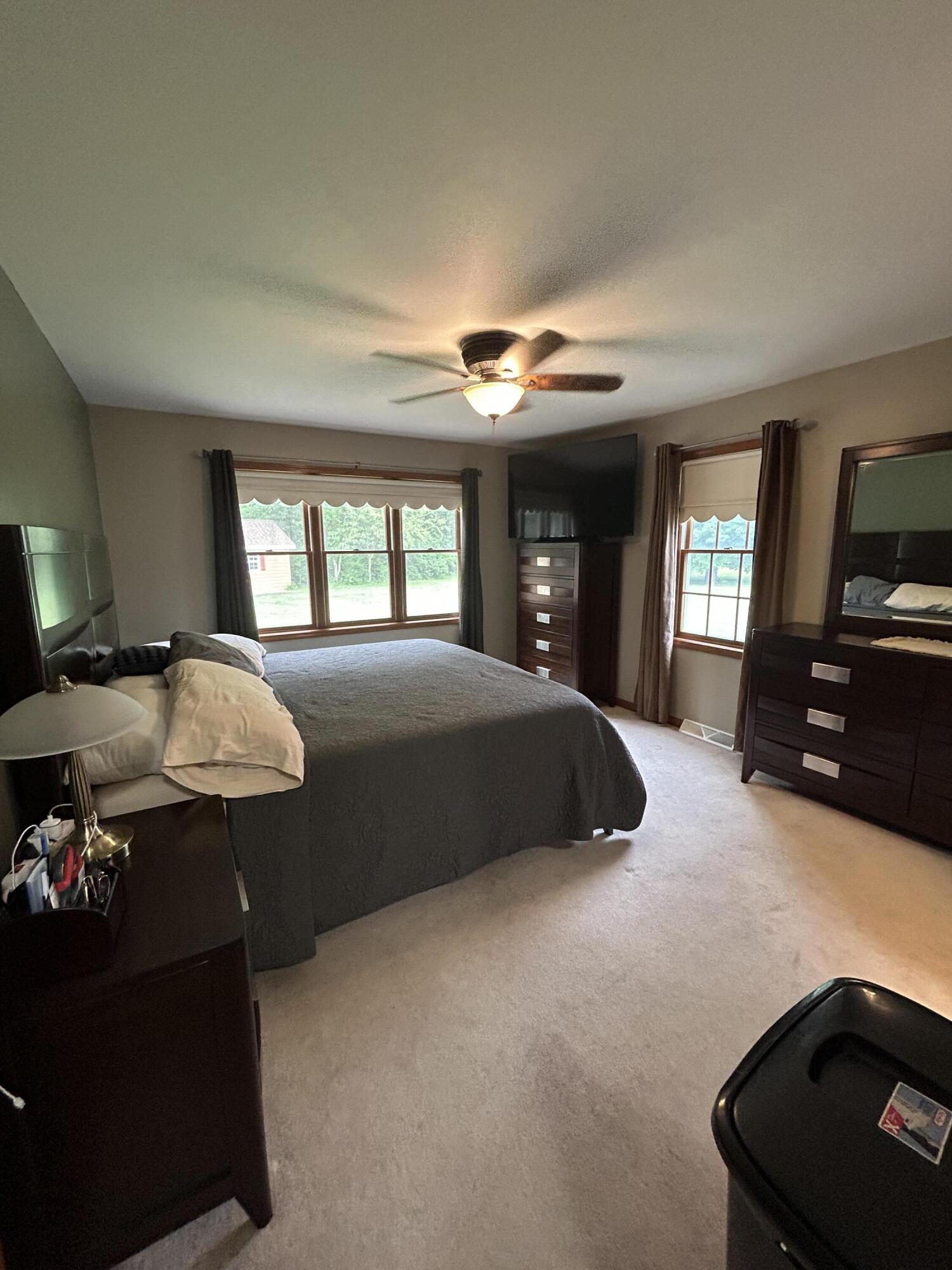 8876 North Lilac Street Demotte, IN 46310 - Photo 16 of 23 a bedroom with a bed and a television