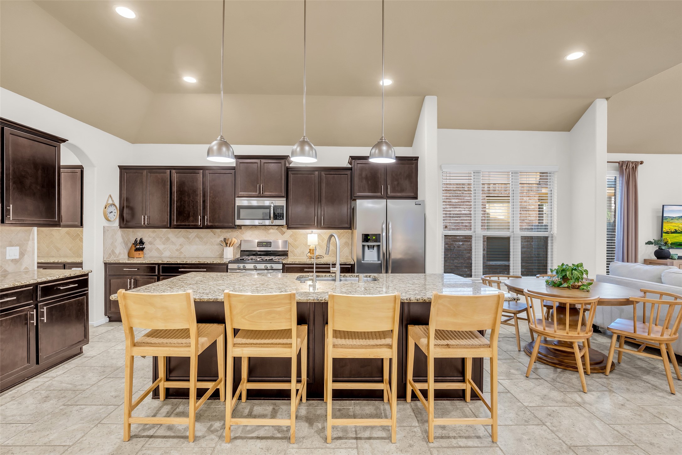 4503 Fenway Park Way Spring, TX 77389 - Photo 10 of 36 Granite counters and stained cabinets