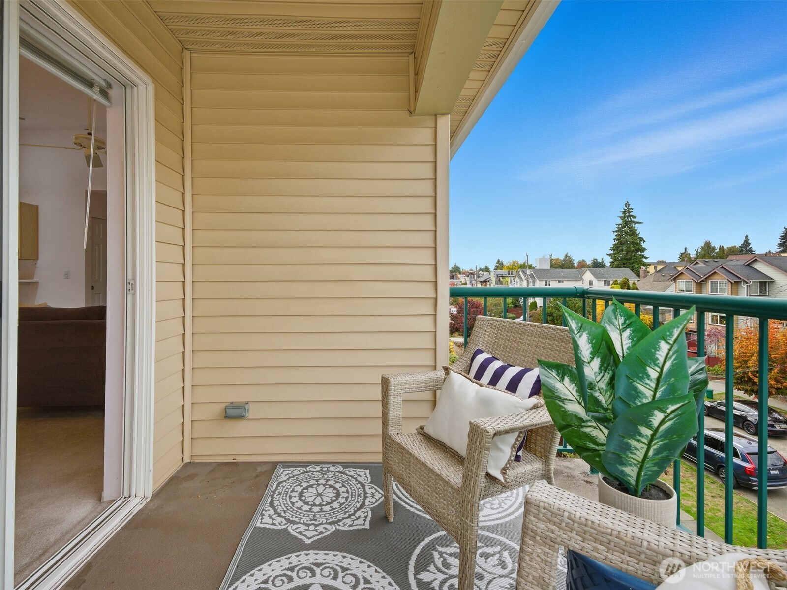1733 Northwest 59th Street, Unit 301 Seattle, WA 98107 - Photo 17 of 35 a view of balcony with couch and potted plants