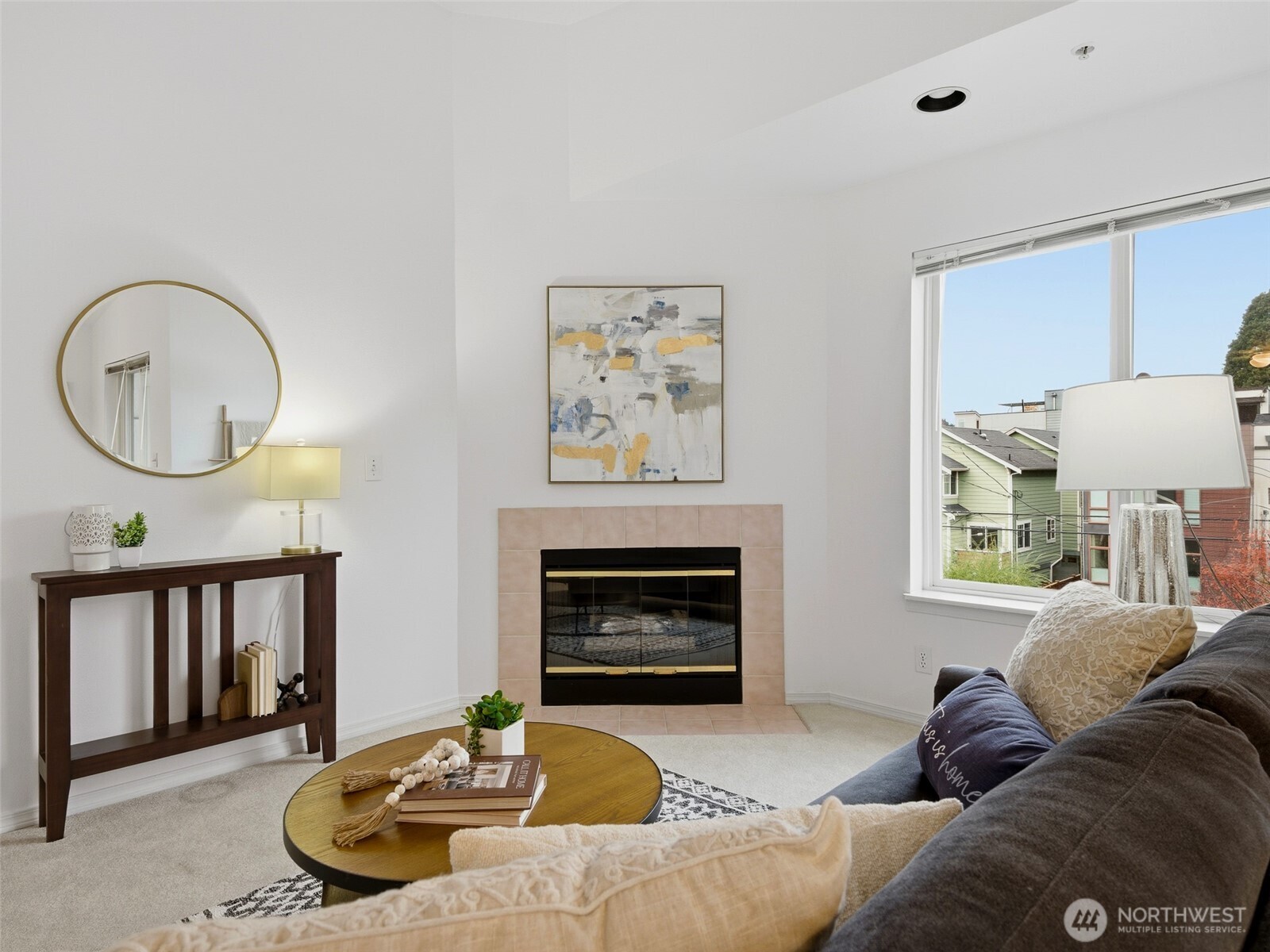 1733 Northwest 59th Street, Unit 301 Seattle, WA 98107 - Photo 19 of 35 a living room with furniture and a fireplace