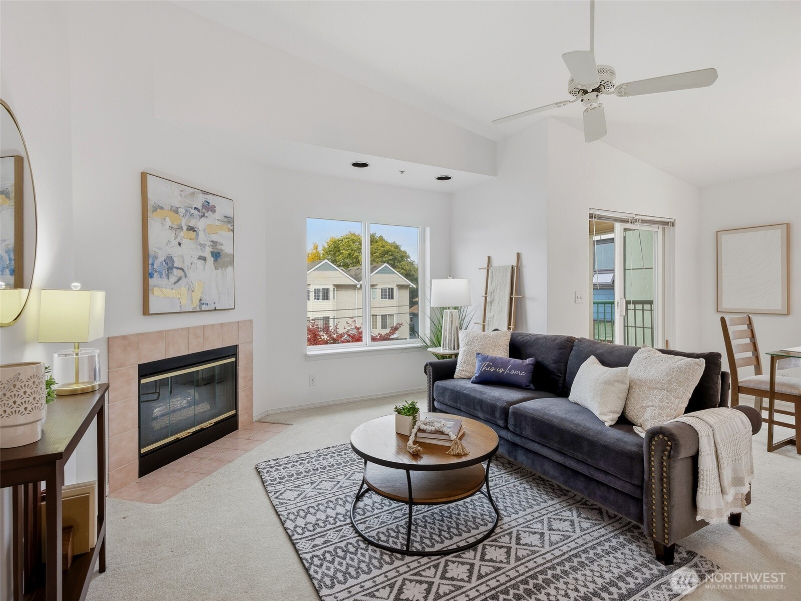 1733 Northwest 59th Street, Unit 301 Seattle, WA 98107 - Photo 20 of 35 a living room with furniture and a fireplace