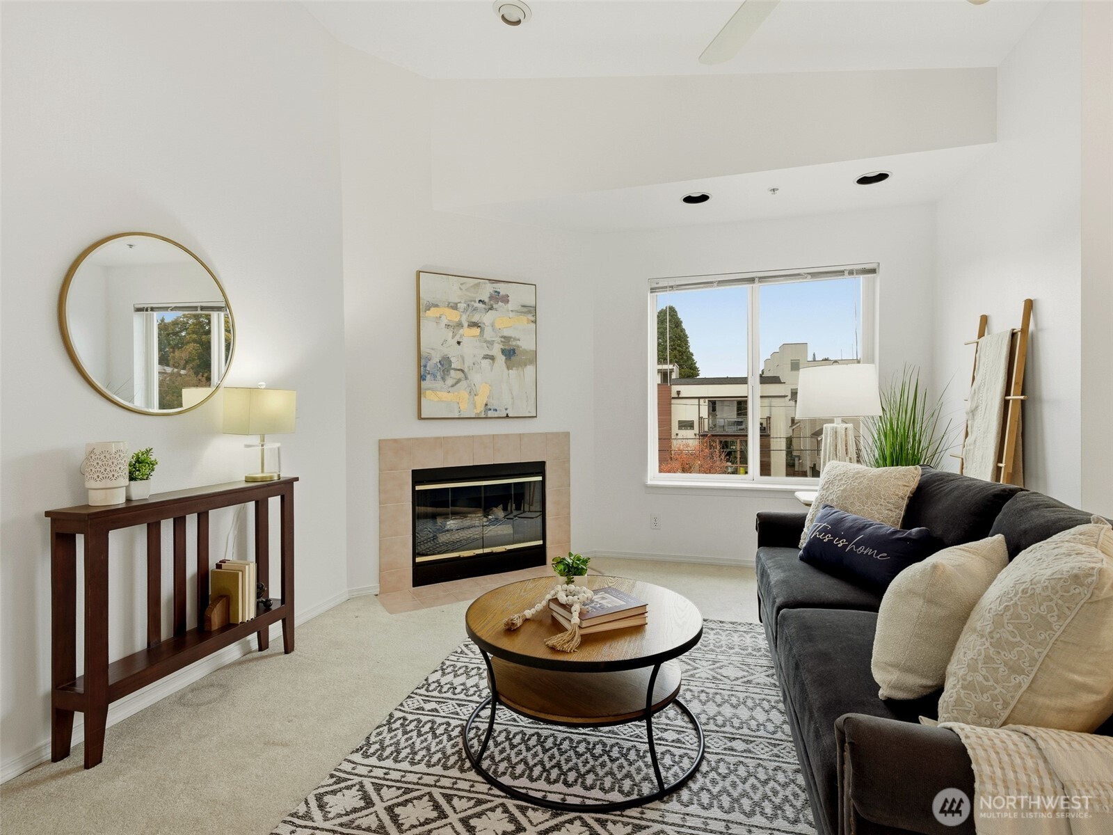 1733 Northwest 59th Street, Unit 301 Seattle, WA 98107 - Photo 21 of 35 a living room with furniture and a fireplace