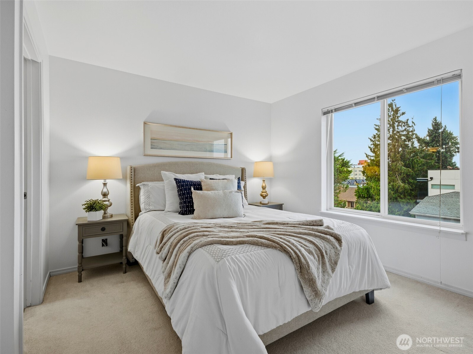 1733 Northwest 59th Street, Unit 301 Seattle, WA 98107 - Photo 23 of 35 a bedroom with a bed and a large window