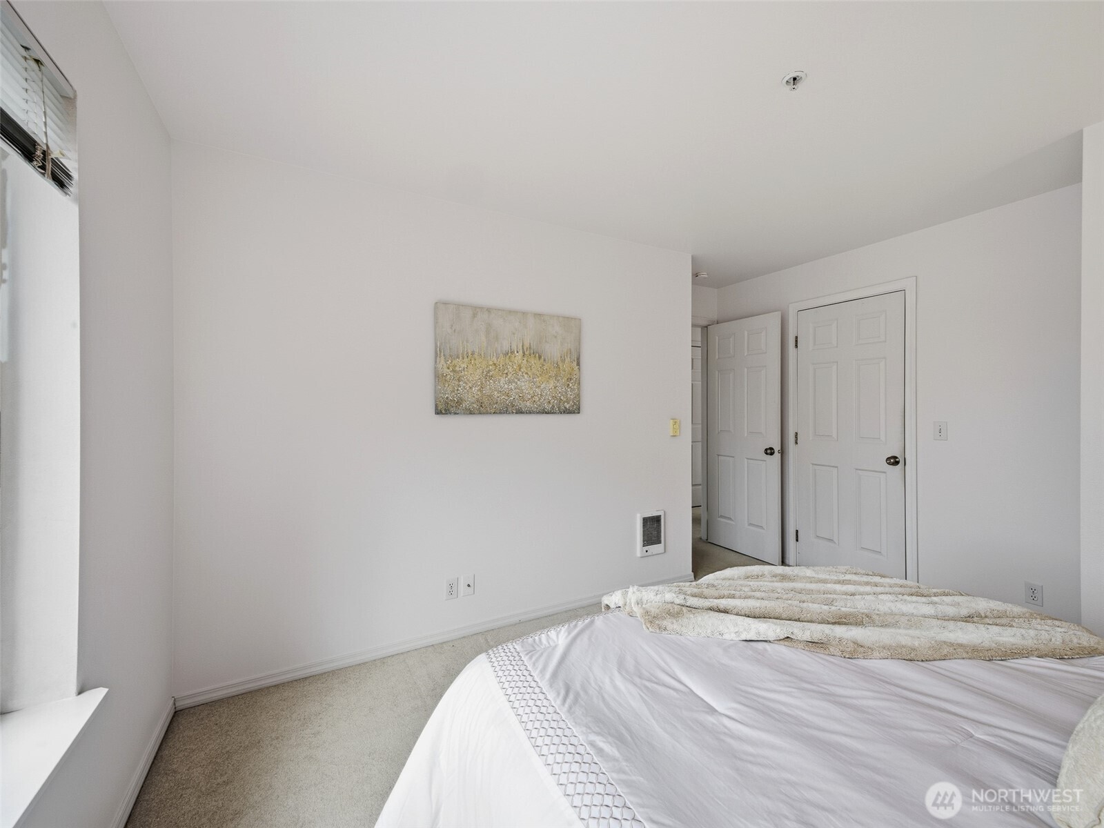 1733 Northwest 59th Street, Unit 301 Seattle, WA 98107 - Photo 25 of 35 a bedroom with a bed and a window